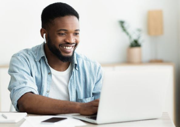 Guy studying on laptop